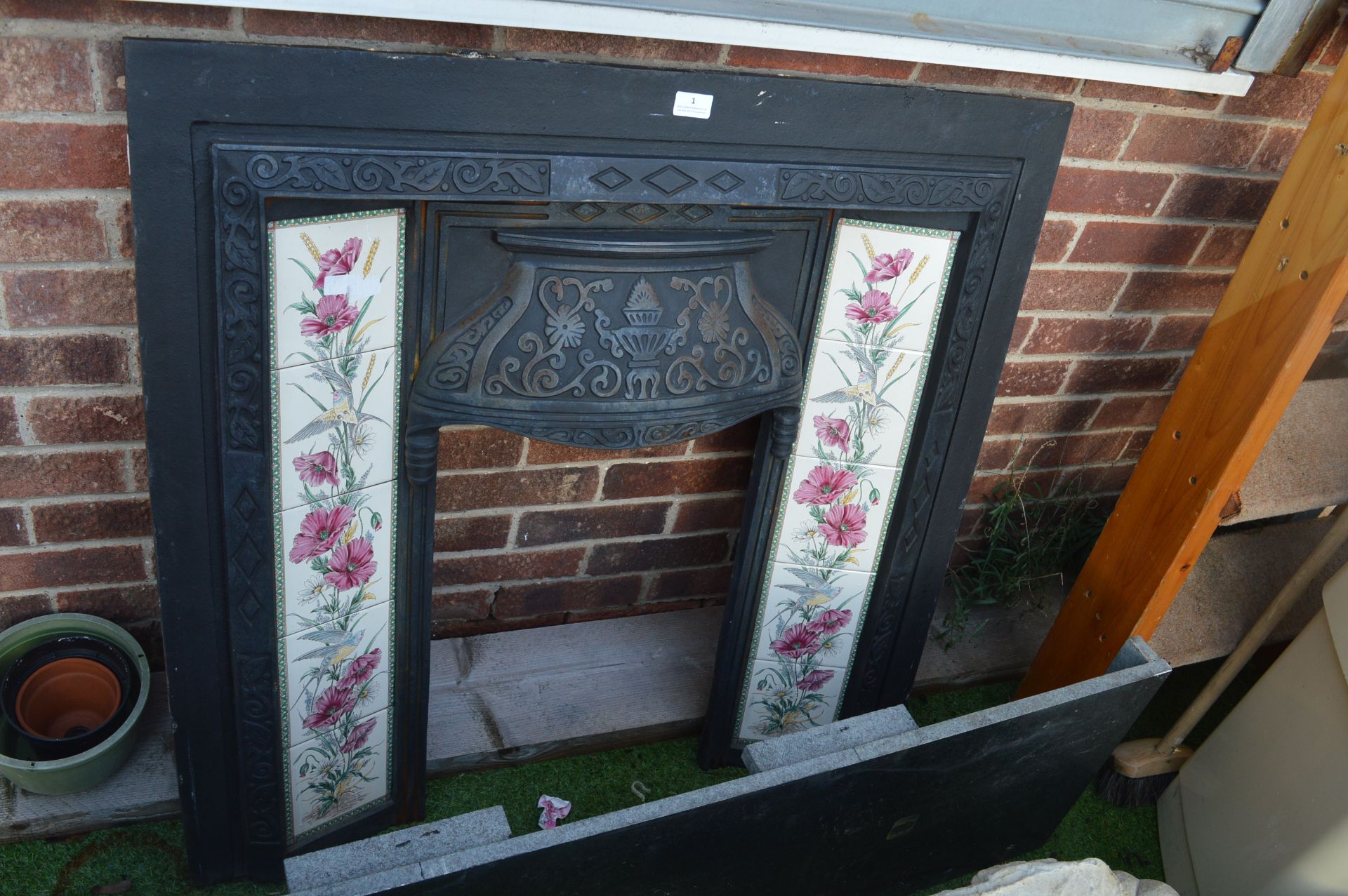 Cast Iron Fireplace with Tiled Insets and Black Ma