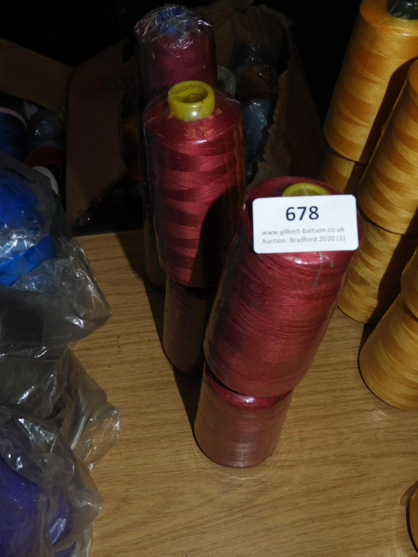 *Six Cones of Maroon Thread