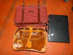 Briefcase and Two Suitcases