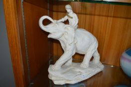 Figurine of a Boy Riding an Elephant