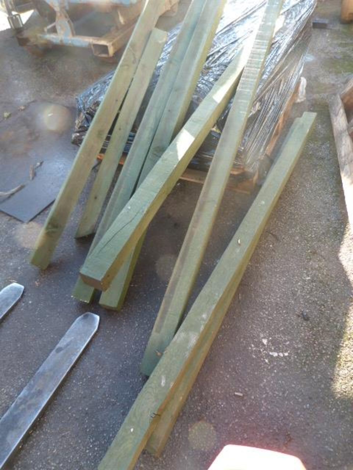Eight Assorted Lengths of 3x3" Treated Timber