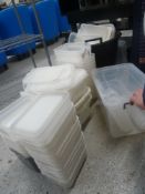 * large quantity of plastic tubs and dispenser bottles
