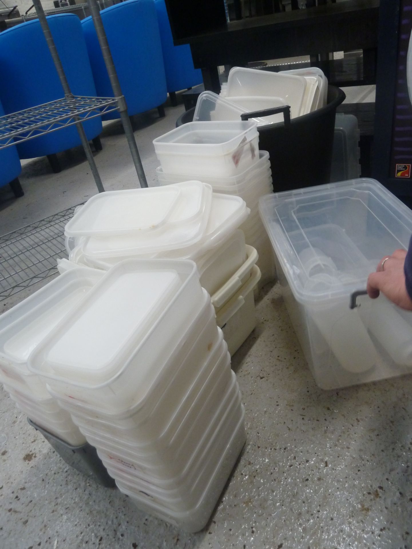 * large quantity of plastic tubs and dispenser bottles
