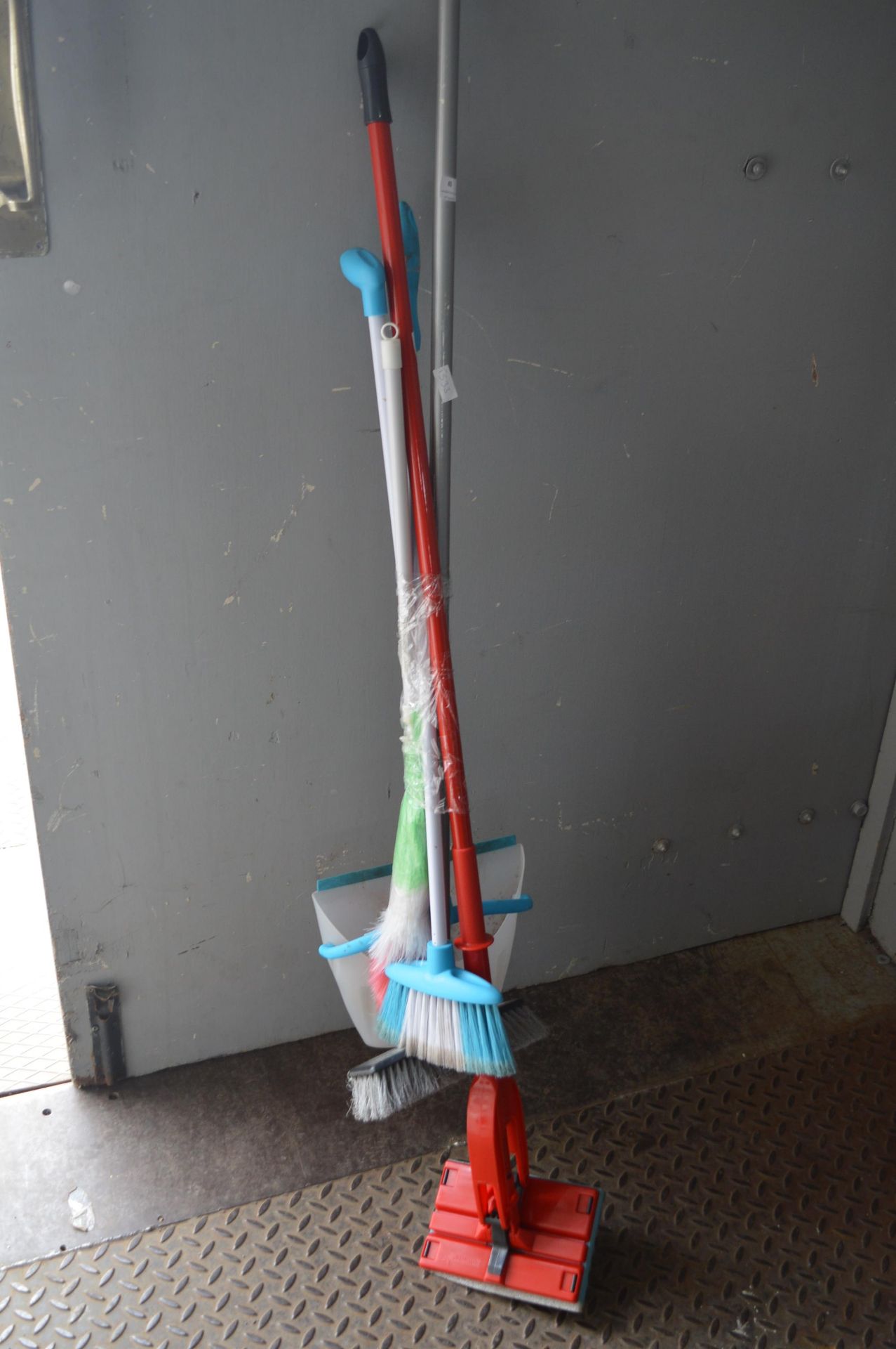 Bundle of Brushes and a Floor Cleaner