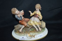 Figure of a Seated Boy & Girl