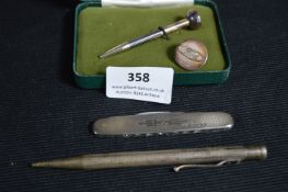 Silver Golf Tee, Pen Knife, Pencil and a Ford Button