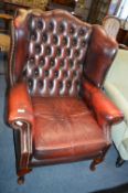 Deep Red Leather Upholstered Chesterfield Wing Back Armchair