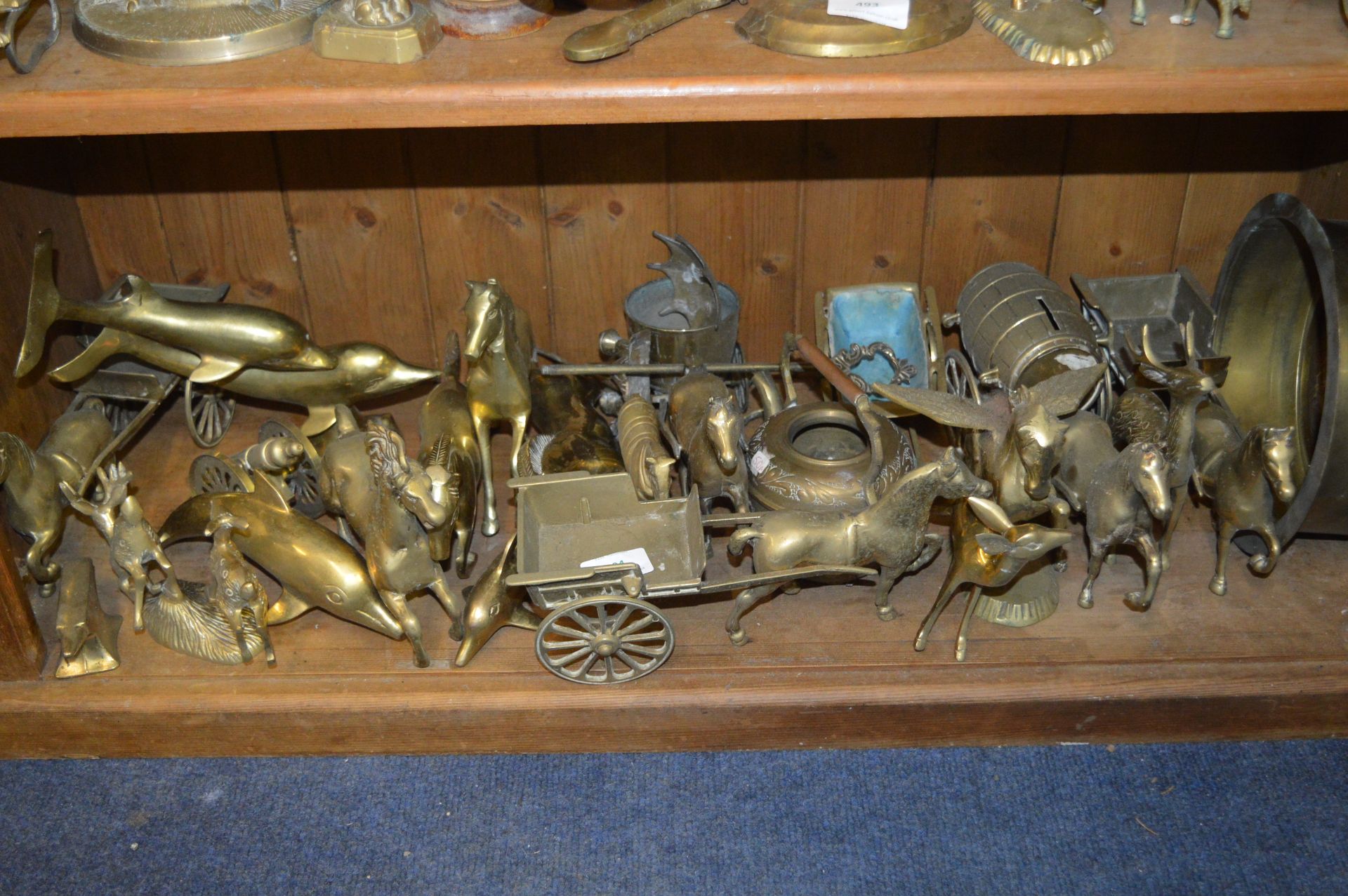 Shelf of Assorted Brass Ornaments
