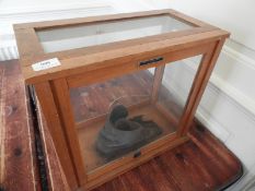 *Glass Display Cabinet Containing an Antique Boot