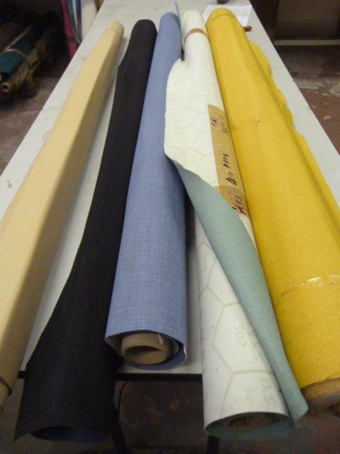 *Five Small Rolls of Leatherette & Various Upholstery Cloth