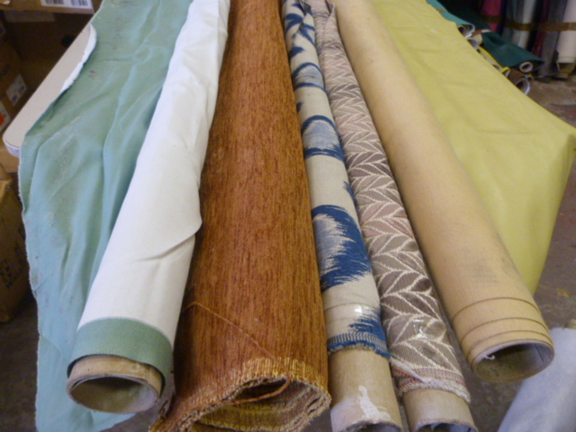 *Five Small Rolls of Assorted Fabrics, Cloth and Material