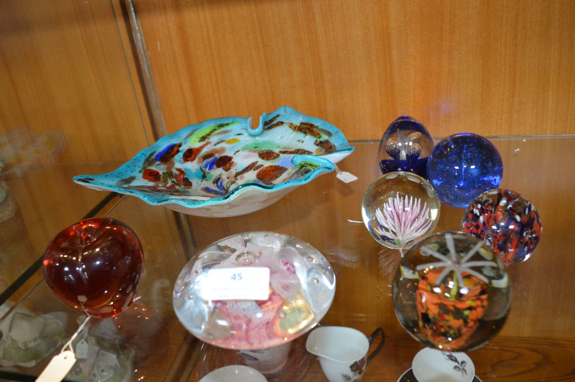 Seven Glass Paperweights and a Glass Dish