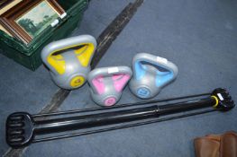 Three Kettle Weights and a Chest Expander