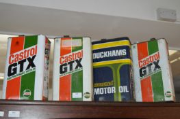Three Castrol and One Duckhams Oil Cans