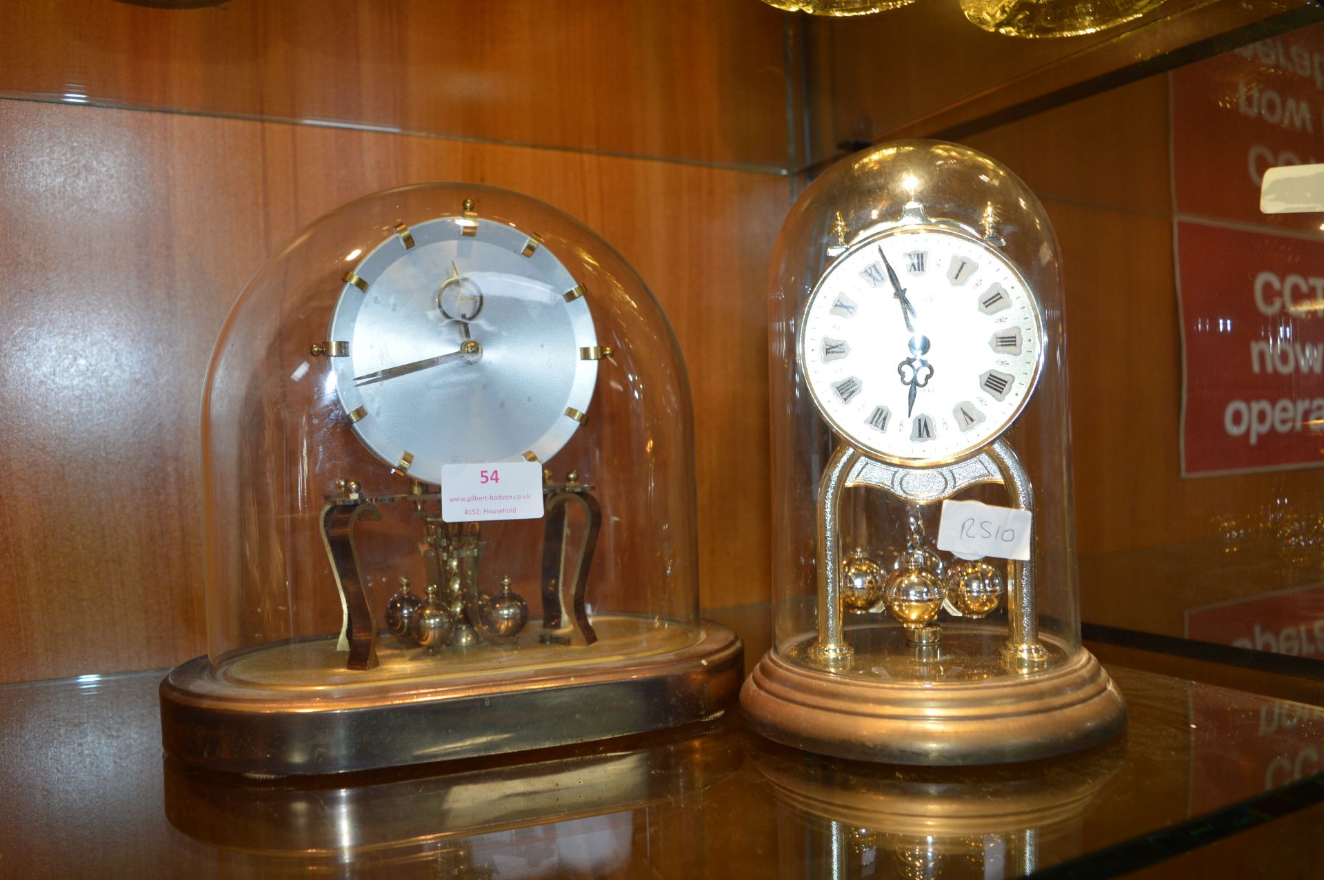 Two Brass Domed Skeleton Clocks