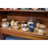 Eight Doulton Lambeth Stoneware Jugs and Beakers