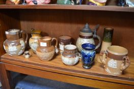 Eight Doulton Lambeth Stoneware Jugs and Beakers