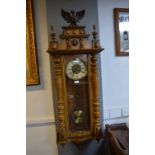Large Vienna Wall Clock with Turned Supports, Lion & Eagle Decoration, and Brass & Enamel Face