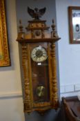 Large Vienna Wall Clock with Turned Supports, Lion & Eagle Decoration, and Brass & Enamel Face