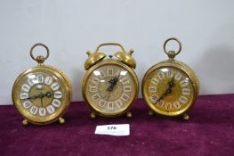 Three Ornate Continental Brass Alarm Clocks