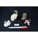 Four Beswick and Royal Doulton Cats
