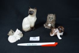 Four Beswick and Royal Doulton Cats