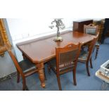 Wind Out Mahogany Dining Table with Four Matching Brown Leather Upholstered Chairs