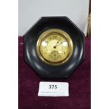 Small Brass Faced Clock in Octagonal Ebony Frame