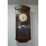 Oak Cased Pendulum Wall Clock with Beveled Glass Front