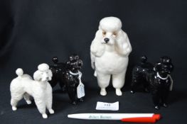 Four Beswick Poodles