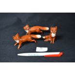 Three Small Beswick Foxes