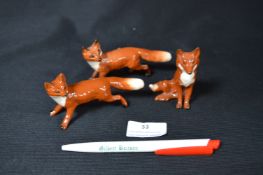 Three Small Beswick Foxes
