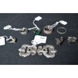 Five Silver Rings, Silver Belt Buckle and a Pair of Silver Cuff links