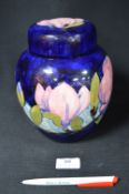 William Moorcroft Magnolia Pattern Covered Jar on Blue Ground