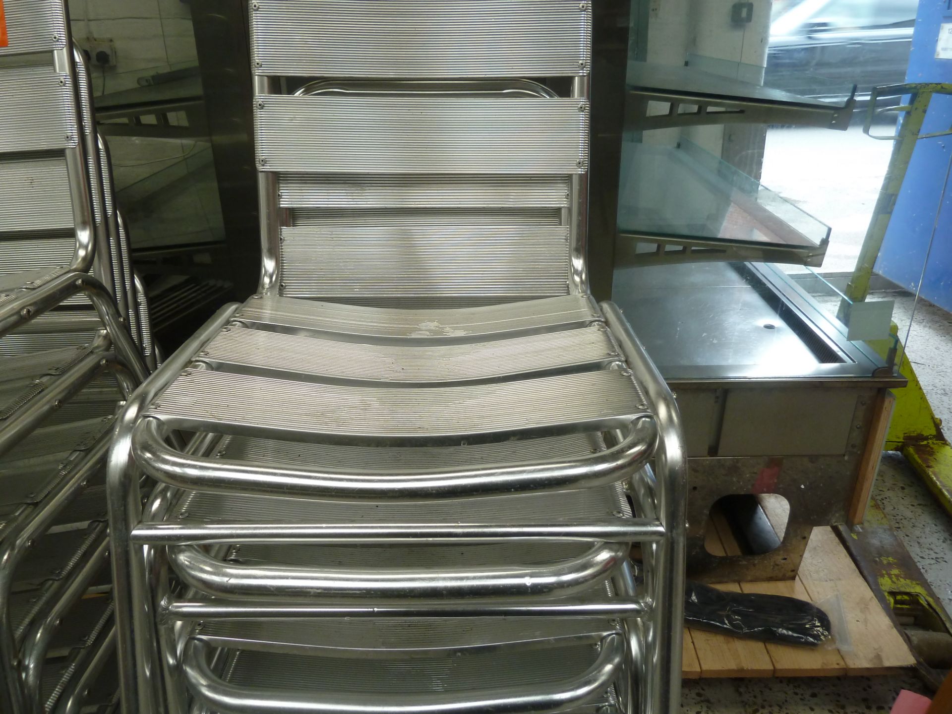 * x8 silver outdoor chairs, great condition, cleaned.