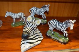 Four Zebra Figures