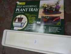 Propagator and a Self Watering Plant Tray