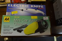 AA Mini Car Vacuum Cleaner plus an Electric Carvin