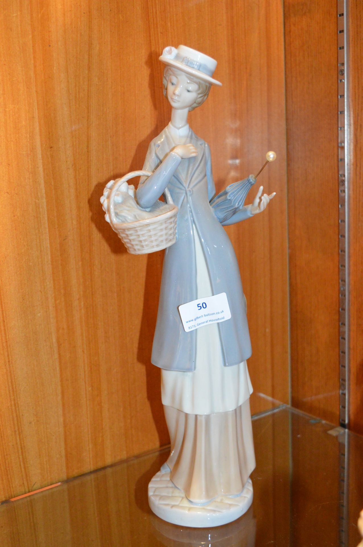 Nao Figure of a Lady with a Basket & Umbrella