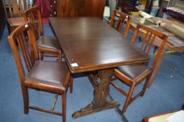 1950's Dark Oak Drawer Leaf Dining Table with Four Upholstered Chairs