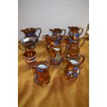 Ten Victorian Copper Luster Jugs