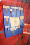 Contents of Showcase to Include Assorted WWII Medals