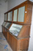 Oak Display Cabinet with Graduated Glass Front Enclosed by Double Doors over Solid Paneled Cupboards