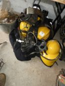 Four Firemen's Jackets and Six Firemen's Helmets, Breathing Apparatus, etc.