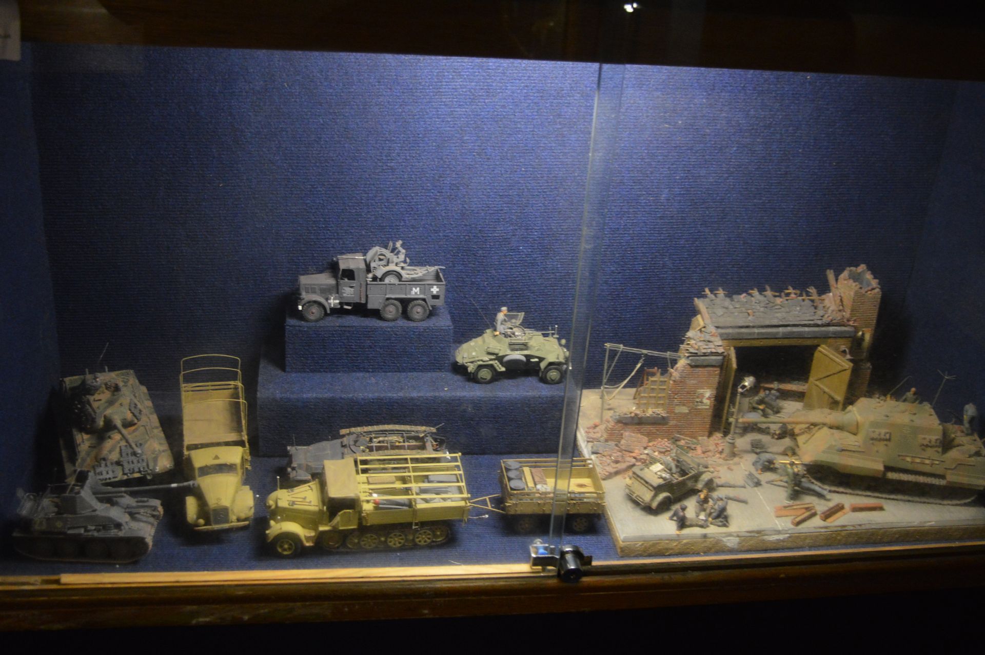 Seven WWII Scale Model Military Vehicles and a WWII Battle Scene