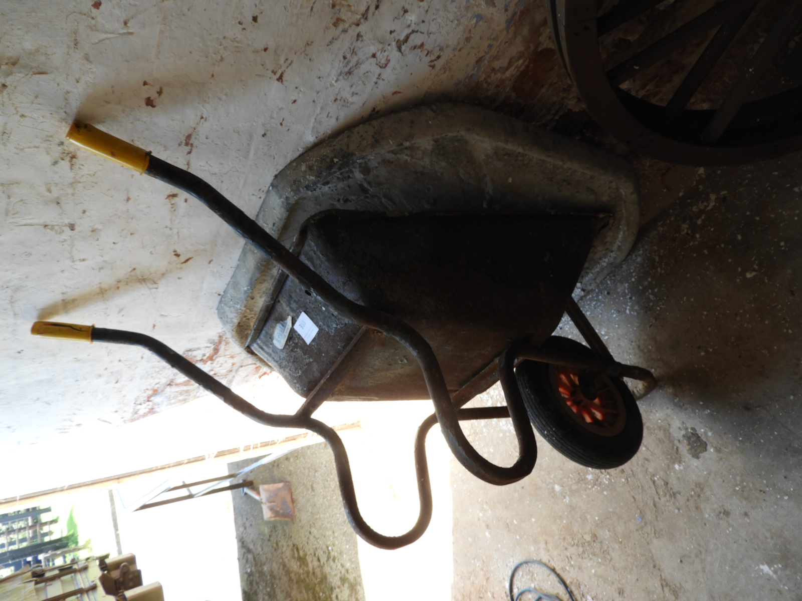 Wheelbarrow and a Cement Mixing Pad