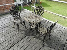 Cast Iron Table with Three Chairs