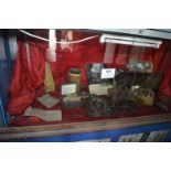 Contents of Showcase to Include Brass Plaque, Gas Mask, Ammunition Box, Gas Eye Shields, Compass and