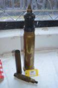 Tank Shell, Large Caliber Cleaning Attachment, and a Brass Shell Case