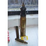 Tank Shell, Large Caliber Cleaning Attachment, and a Brass Shell Case